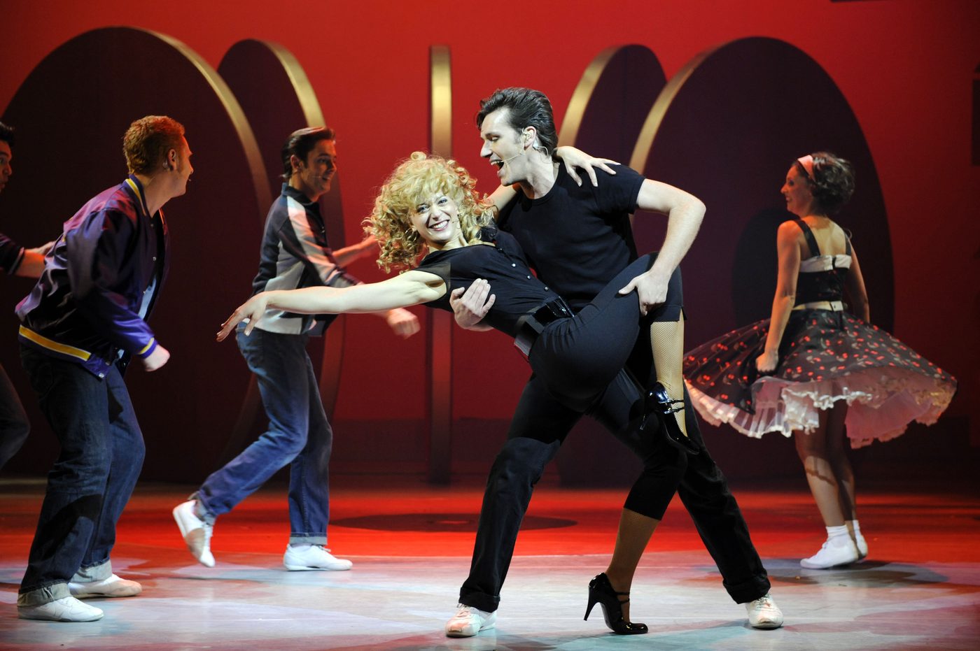 Sasha als Sandy in de musical Grease